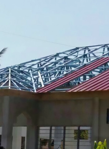 Thung Hing's healthcare project in Kemaman Hospital, Terengganu, showcasing TH C-Purlin galvanized steel roof framing on a partially completed building with red roof.